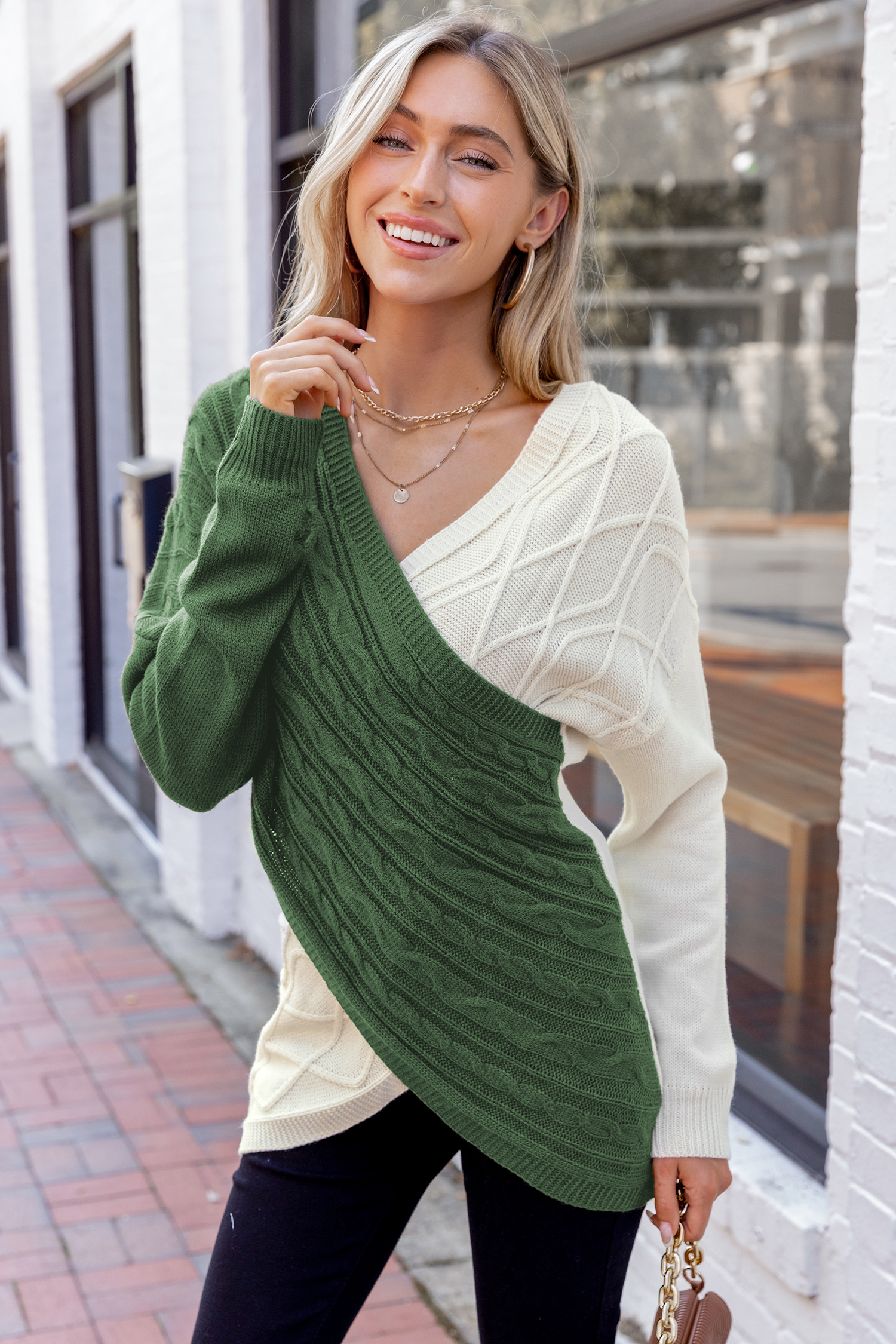 Suéter de punto trenzado con bloques de color verde y beige