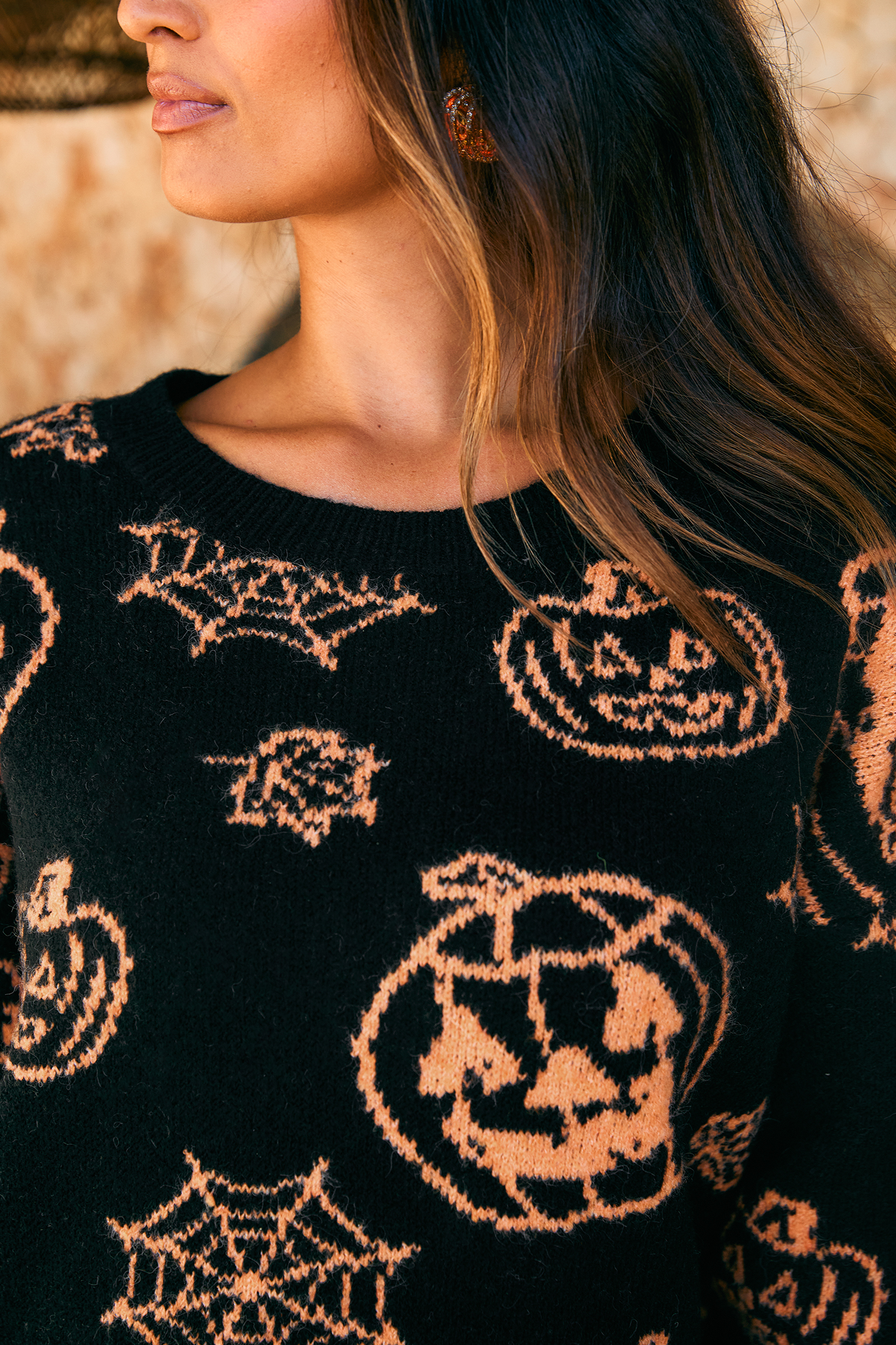 Pull noir en tricot col rond manches longues
