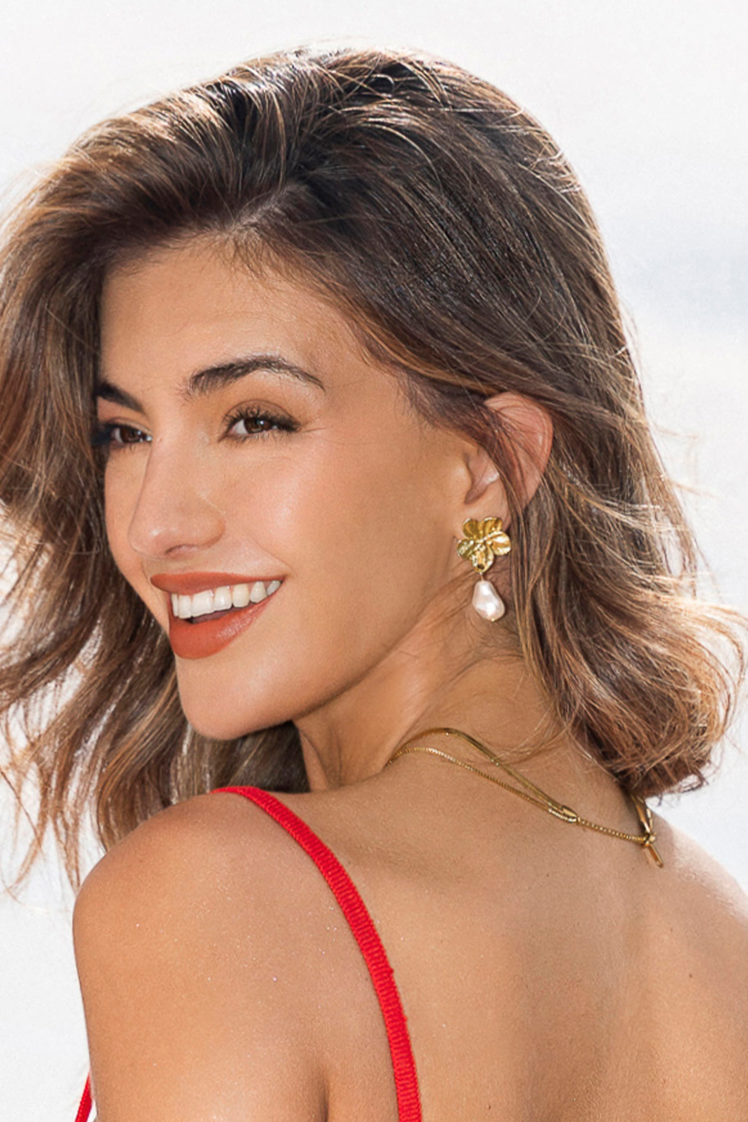 Pendientes dorados con margaritas de sirena