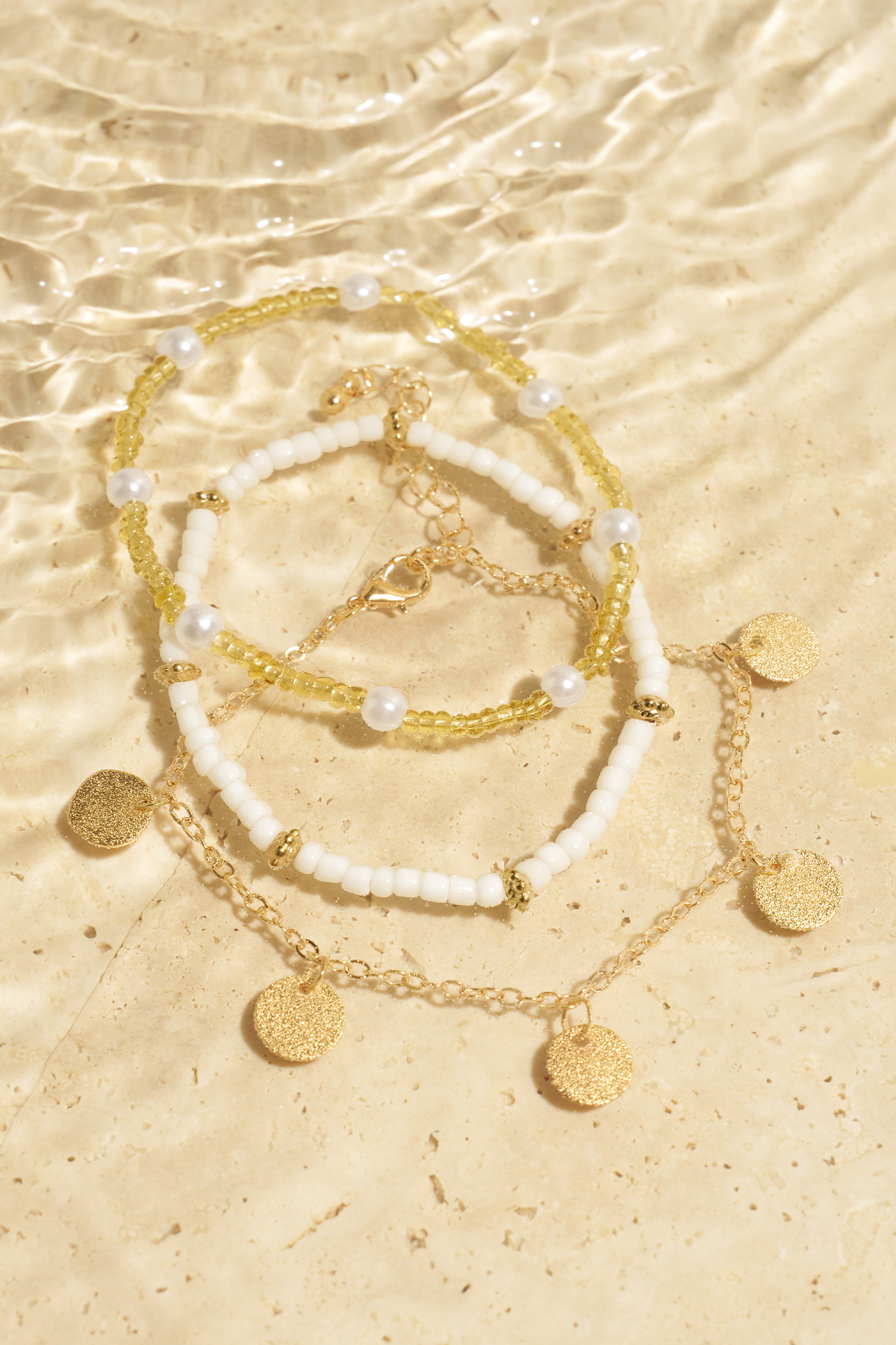 Set di cavigliere color oro 