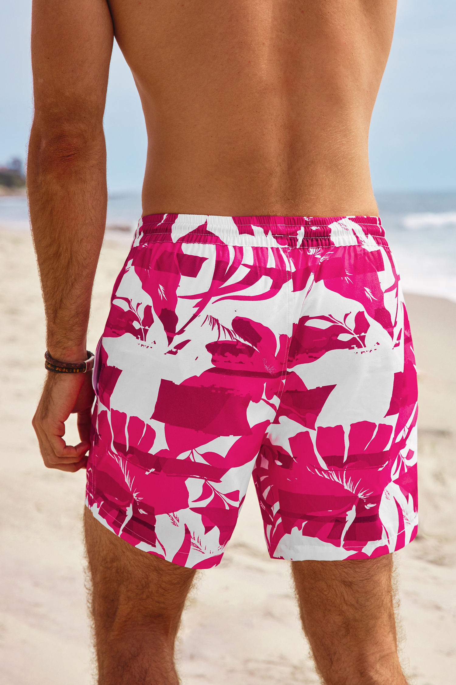Pantalones cortos de baño tropicales rumbo al oeste