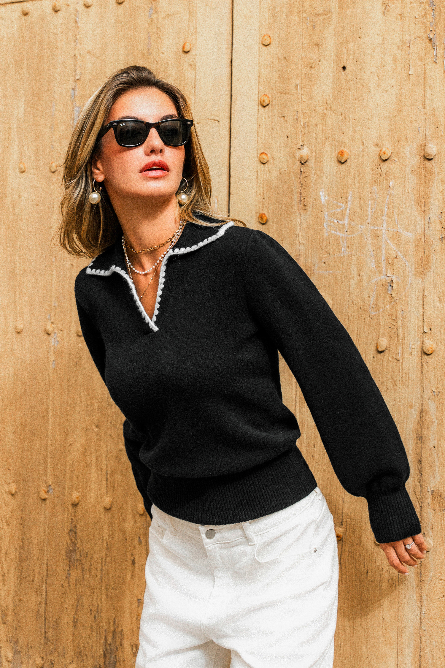 Pull noir en tricot à col chemise et manches longues